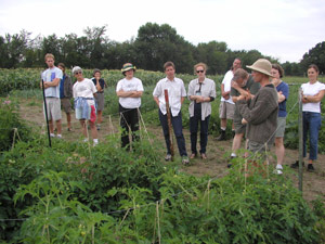 Claire speaking to a group of visitors.